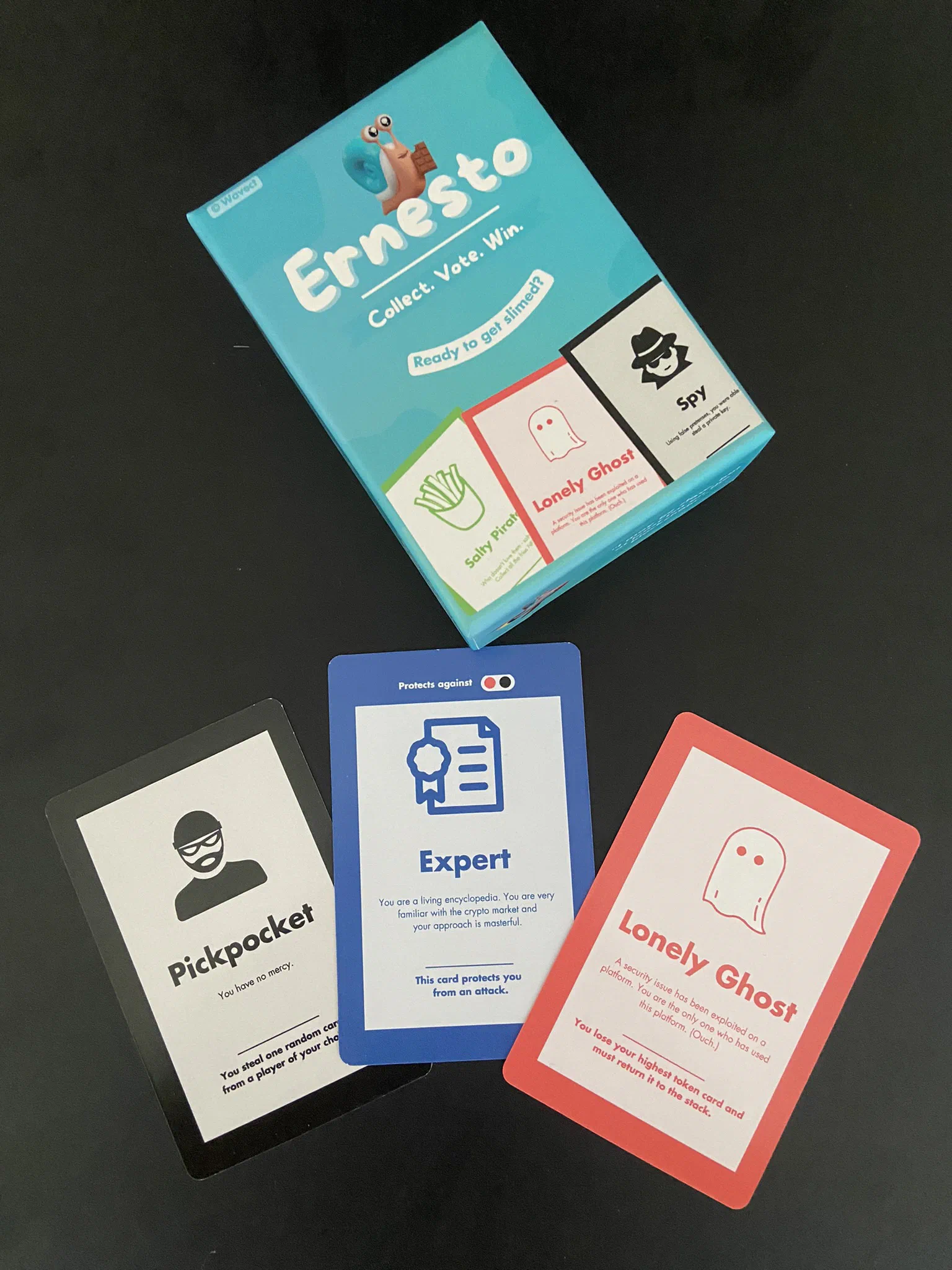 Ernesto card game box with several illustrated playing cards