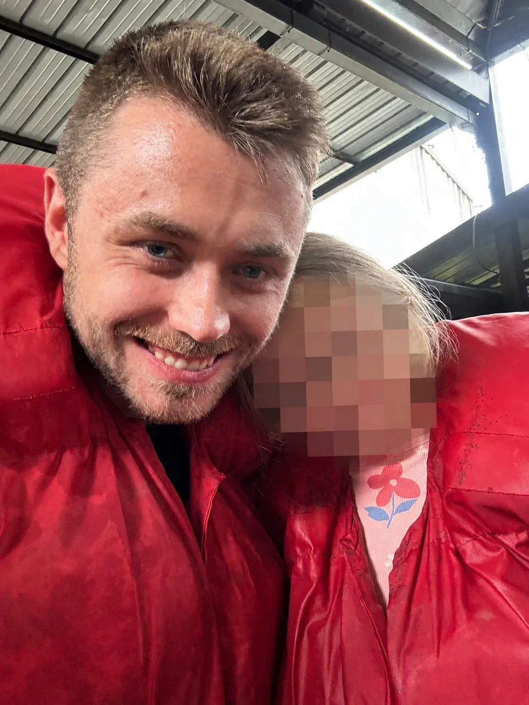 Kevin Riedl with his daughter, whose face is heavily pixelated for privacy Kevin Riedl with his daughter, whose face is heavily pixelated for privacy